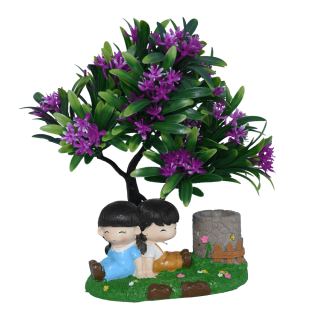 Show Piece boy and girl in garden under tree 